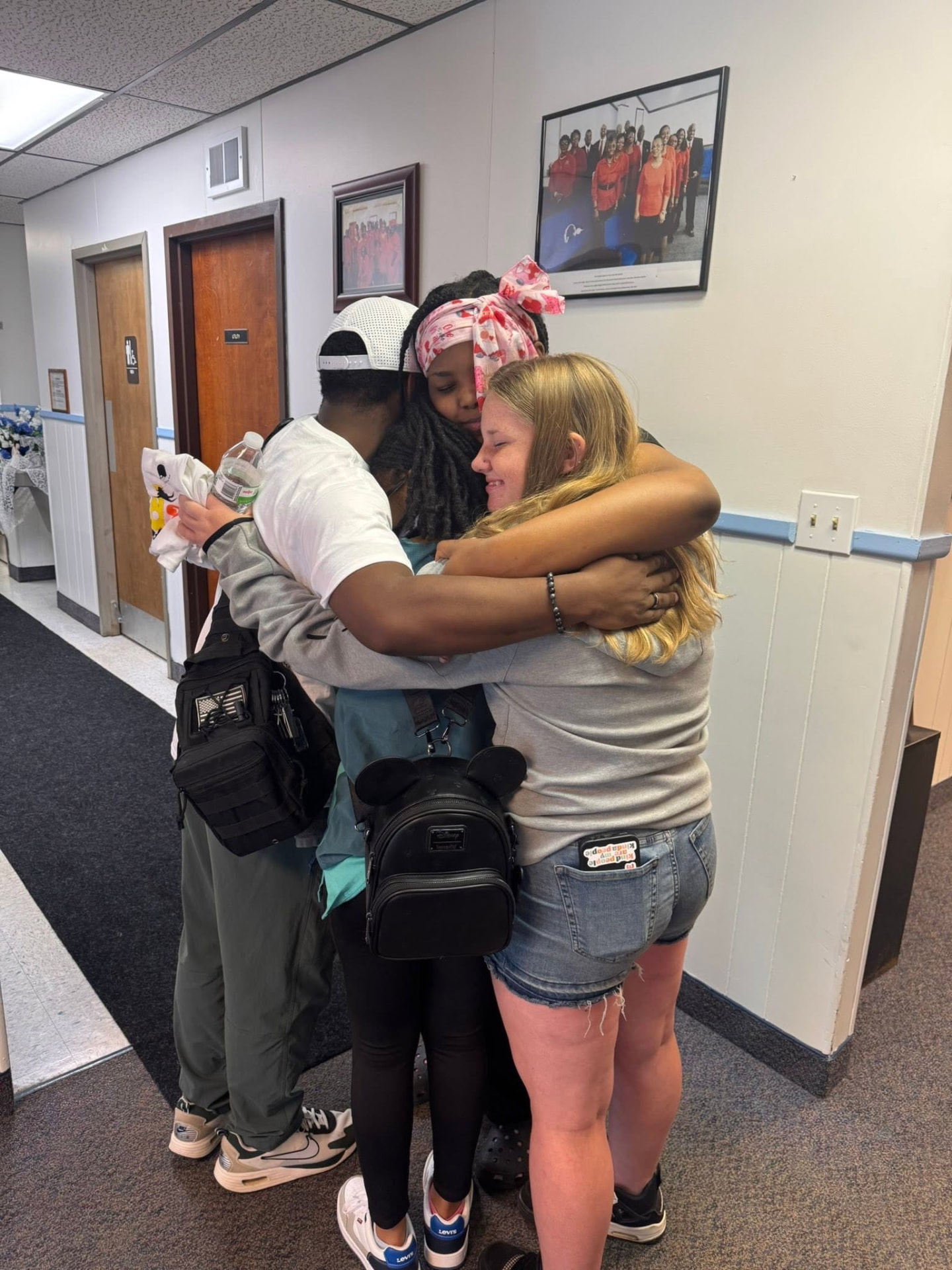 FliKidz community members sharing a group hug